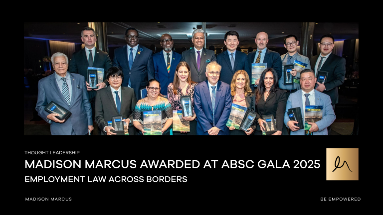 Group of professionals holding awards and books, posing together at the ABSC Gala 2025. Banner text reads "Madison Marcus Awarded at ABSC Gala 2025 – Employment Law Across Borders."