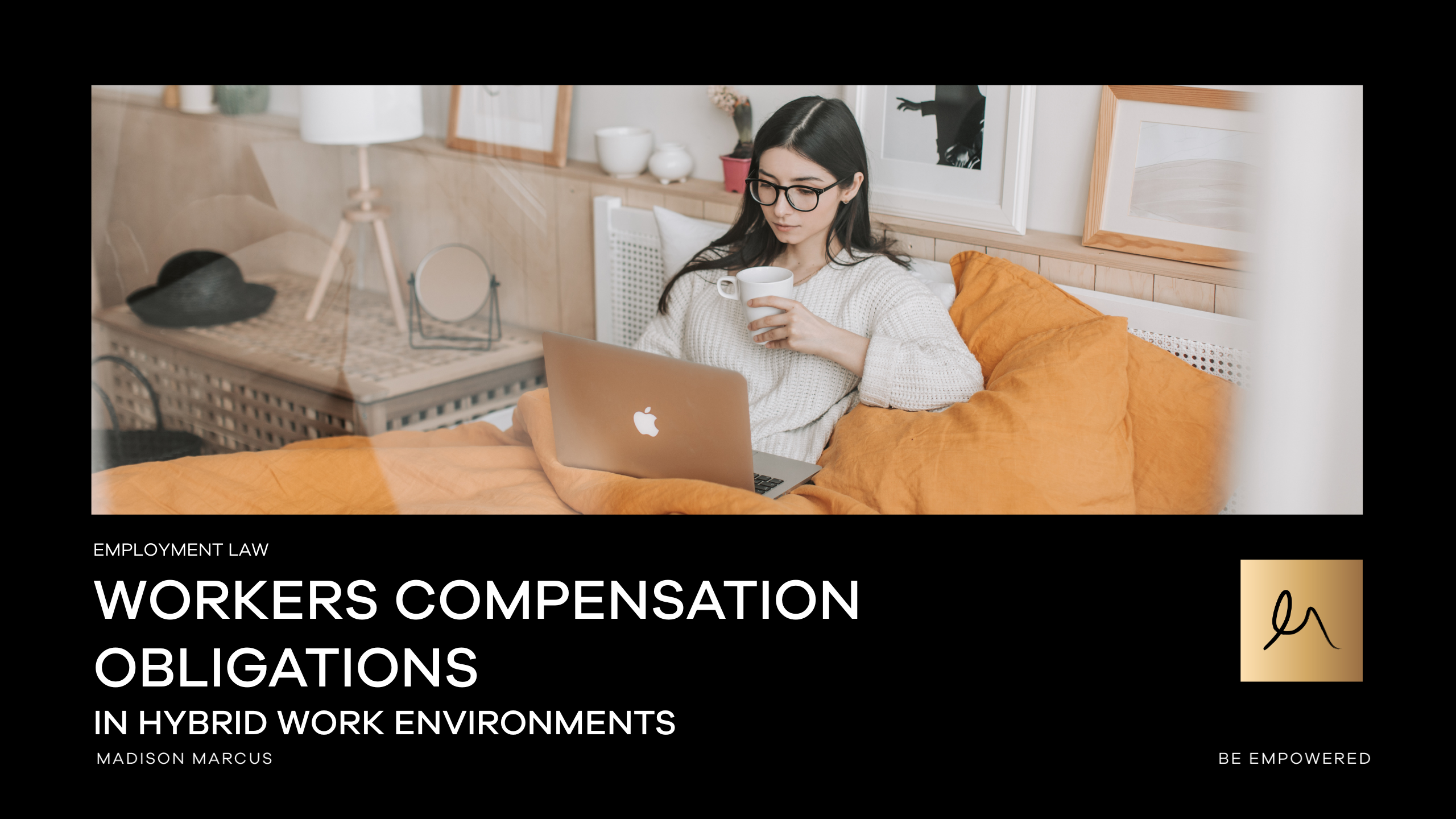 An employee works remotely from home using a laptop while seated on a bed, representing hybrid work arrangements and employer obligations for workers compensation outside the traditional office.