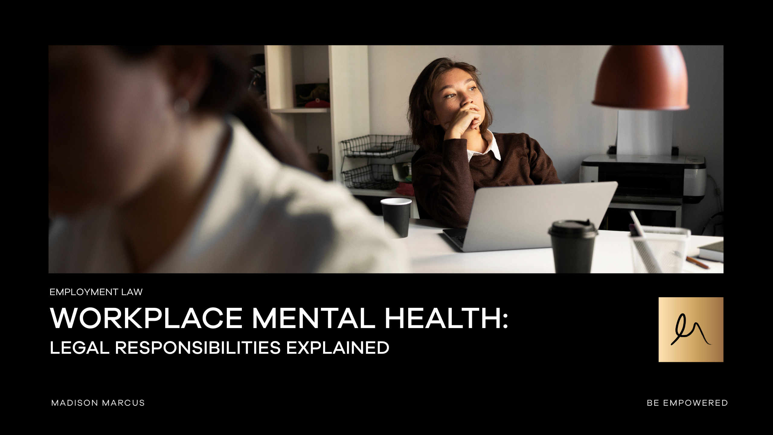 An employee sits at a desk looking thoughtful and fatigued, conveying workplace mental health challenges and the importance of employer care obligations.